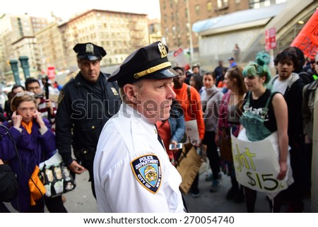 NEW YORK CITY - APRIL 15 2015: students, adjuncts & union representatives gathered at Columbia University for a rally & march to an UWS McDonald's demanding a $15 per hour federal minimum wage.