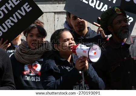 NEW YORK CITY - APRIL 15 2015: high school students, union activists & fast food workers marched in Manhattan's Upper West Side to demand a $15 per hour federal minimum wage.