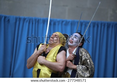 NEW YORK CITY - MAY 10 2015: the ninth annual Japan Day was celebrated in Central Park with demonstrations of folk-dance, swordsmanship, calligraphy, kabuki face painting & Japanese foods.