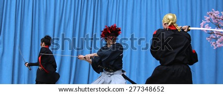 NEW YORK CITY - MAY 10 2015: the ninth annual Japan Day was celebrated in Central Park with demonstrations of folk-dance, swordsmanship, calligraphy, kabuki face painting & Japanese foods.