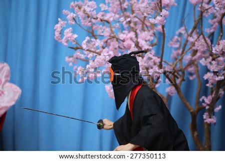 NEW YORK CITY - MAY 10 2015: the ninth annual Japan Day was celebrated in Central Park with displays of swordsmanship, folk-dance, music, Japanese food, calligraphy & kabuki face-painting