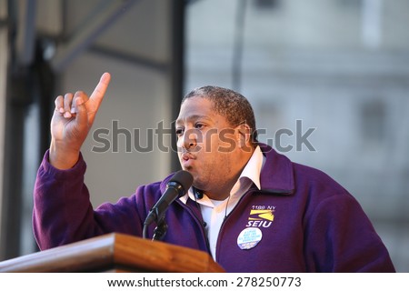 NEW YORK CITY - MAY 14 2015: several thousand tenants along with city council & state assembly members staged a march across the Brooklyn Bridge for affordable housing. SEIU's Dell Smitherman