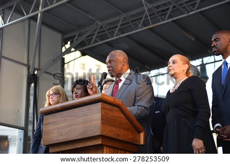 NEW YORK CITY - MAY 14 2015: several thousand tenants along with city council & state assembly members staged a march across the Brooklyn Bridge for affordable housing. Assembly member Keith Wright