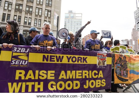 NEW YORK CITY - MAY 20 2015: labor & union activists gathered along Varick St to urge the first meeting of the NY Labor Board to set a statewide minimum wage of $15/hr.