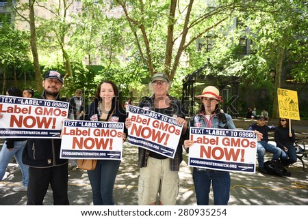 NEW YORK CITY - MAY 23 2015: environmental activists joined a global day out against Monsanto\'s GMO programs & demanding that foods be labeled.