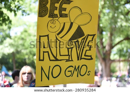 NEW YORK CITY - MAY 23 2015: environmental activists joined a global day out against Monsanto's GMO programs & demanding that foods be labeled.