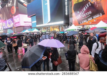 NEW YORK CITY - JUNE 1 2015: the 22nd annual Taste of Times Square brought more than 50 local restaurants & hotels together where thousands braved the rain to sample their offerings
