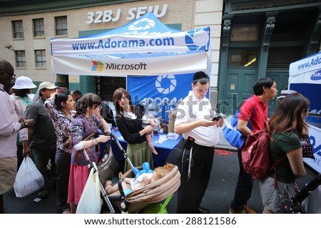 NEW YORK CITY - JUNE 14 2015: landmark NYC camera & tech store Adorama hosted its annual Family Fun Day on 18th St, permitting camera & tech vendors the opportunity to display their newest products