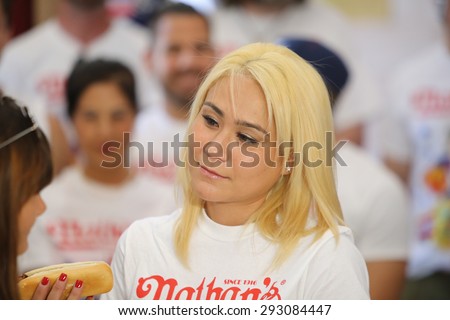 NEW YORK CITY - JULY 3 2015: contestants participating in Nathan\'s Famous July 4th hot dog eating contest gathered at Brooklyn\'s borough hall for weigh in presided over by Eric Adams & George Shea