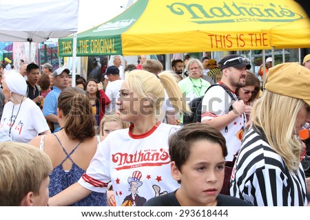 NEW YORK CITY - JULY 4 2015: Nathan\'s Famous staged its annual fourth of July hot dog eating contest in Coney Island, Brooklyn. Miki Sudo passing through the crowd