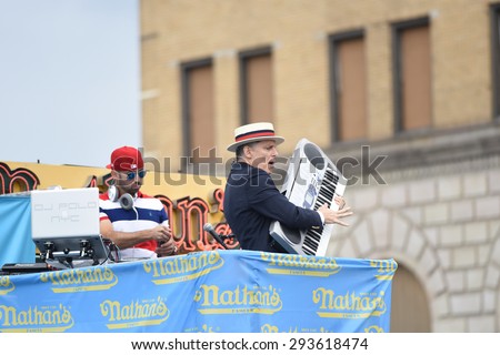 NEW YORK CITY - JULY 4 2015: Nathan\'s Famous staged its annual fourth of July hot dog eating contest in Coney Island, Brooklyn. George Shea performs