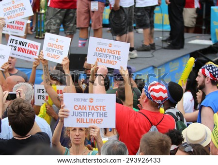 NEW YORK CITY - JULY 4 2015: Nathan\'s Famous staged their annual fourth of July hot dog eating contest in Coney Island, Brooklyn. Collectively Free protests contest
