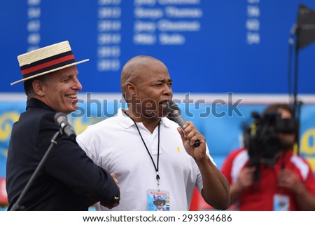 NEW YORK CITY - JULY 4 2015: Nathan\'s Famous held its annual fourth of July hot dog eating contest in Coney Island, Brooklyn. MC & promoter George Shea with borough president Eric Adams