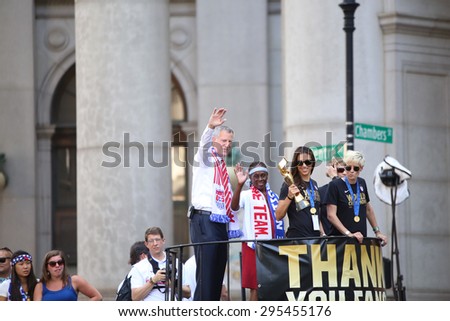 NEW YORK CITY - JULY 11 2015: a ticker tape parade was held for the champion US women\'s FIFA team along Canyon of Heroes on Broadway. Mayor de Blasio rides with US women\'s FIFA team