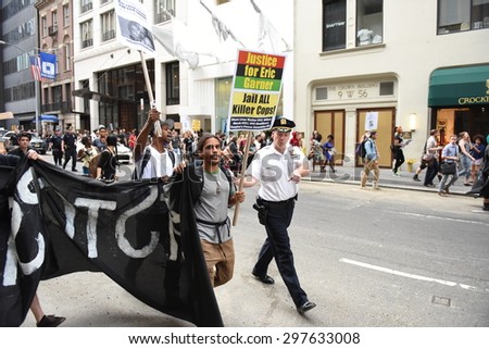 NEW YORK CITY - JULY 17 2015: Million March NYC staged a rally at Columbus Circle & march to commemorate the one year anniversary of Eric Garner\'s death. Several arrests ensued