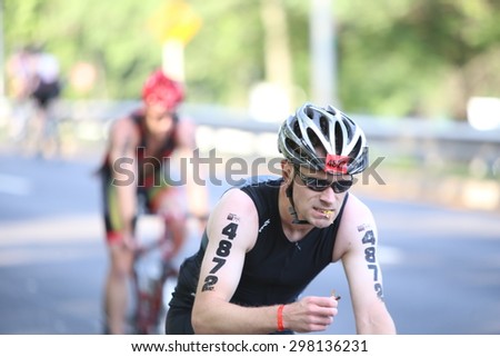 NEW YORK CITY - JULY 19 2015: thousands endured heat & humidity to complete the final 10 kilometer leg of the NYC Panasonic Triathlon in Central Park