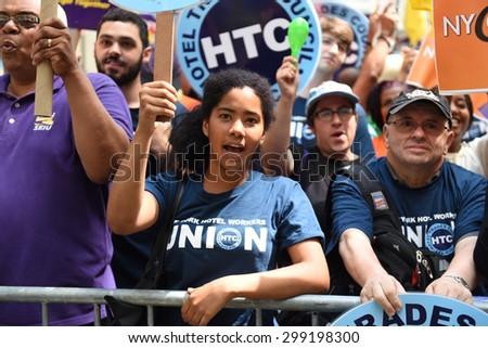 NEW YORK CITY - JULY 12 2015: organized labor, fast food workers & elected officials gathered on Barclay St. to celebrate the NY wage board\'s recommendation for a $15/hr minimum wage statewide by 2021
