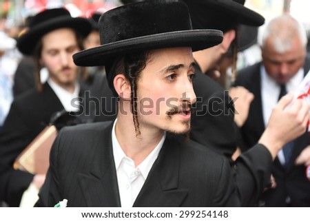 NEW YORK CITY - JULY 22 2015: thousands rallied in Times Square to oppose the President\'s proposed nuclear deal with Iran. Anti-zionist Neturei Karta members attend rally in Times Square