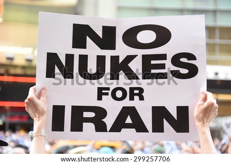 NEW YORK CITY - JULY 22 2015: thousands rallied in Times Square to oppose the President\'s proposed nuclear deal with Iran. No Nuke for Iran poster