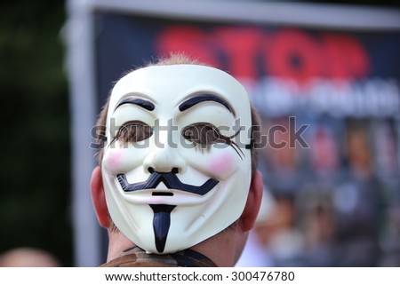 NEWARK, NEW JERSEY - JULY 25 2015: More than one thousand activists gathered for a rally & march against police brutality. Guy Fawkes mask