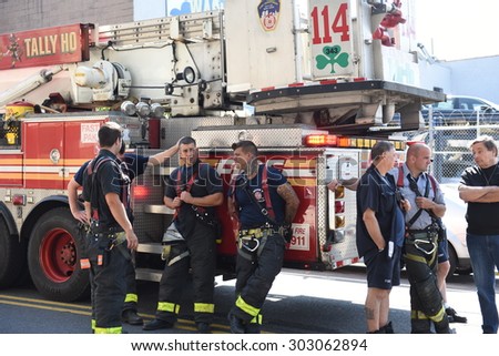 NEW YORK CITY - AUGUST 4 2015: a massive sinkhole erupted in the Sunset Park neighborhood of Brooklyn, closing several streets & bringing FDNY, OEM & DEP, Con Ed & National Grid.