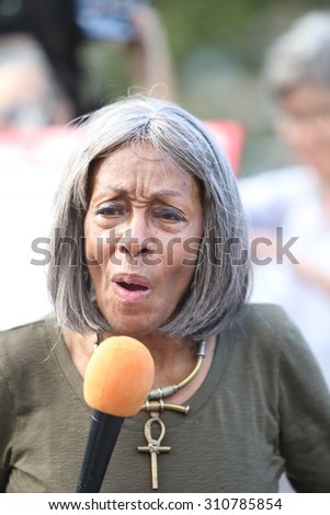 NEW YORK CITY - AUGUST 26 2015: the International Women\'s Day Coalition staged a rally in Union Square featuring speakers of issues of concern to women as well as activists on behalf of Ayotzinapa.