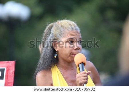 NEW YORK CITY - AUGUST 26 2015: the International Women\'s Day Coalition staged a rally in Union Square featuring speakers of issues of concern to women as well as activists on behalf of Ayotzinapa.