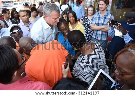 NEW YORK CITY - AUGUST 29 2015: Mayor Bill de Blasio and NYC first lady Chirlane McCray visited hair salons in Brooklyn to encourage patrons to sign their children up for Pre-K