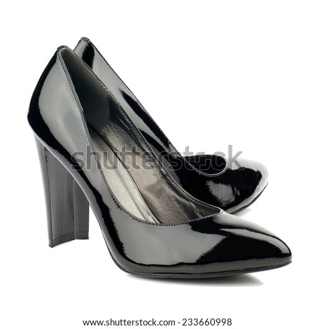 Black patent high heel women shoes isolated on white.