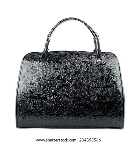 Black patent female handbag isolated on white background.