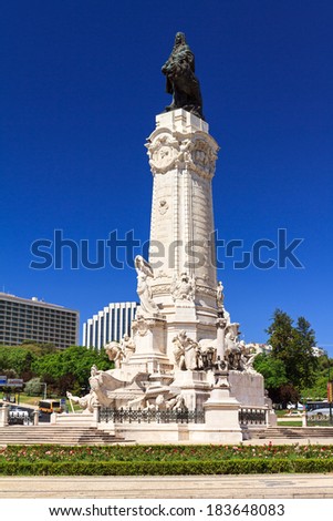 Statue on the Marquess of Pombal Square against a blue sky in Lisbon, Portugal,