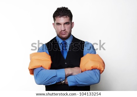 handsome business type man wearing rubber arm bands looking at the camera