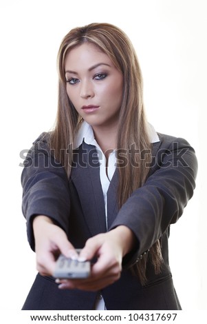 woman holding a TV remote control know what buttons to press and being in control at work