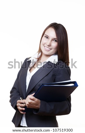 very young looking woman in a suit just starting out trying to do well in business holding note book and files