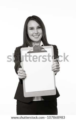 very young looking woman in a suit just starting out in business  holding up a clip board