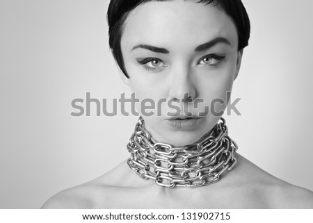 sexy woman with chain wrapped around her neck