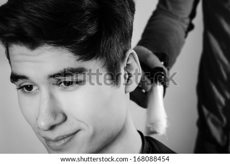 close up shot of man getting his hair cut