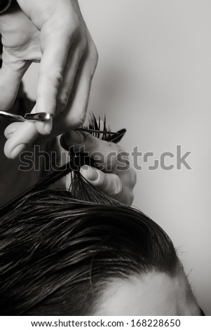 close up shot of man getting his hair cut