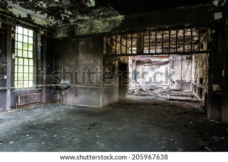 inside view of a deserted run down building after a fire