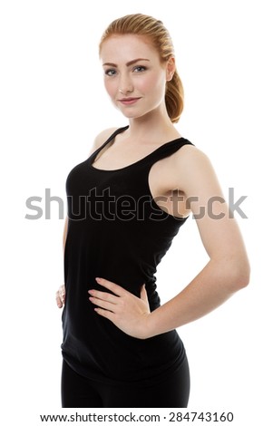 standing woman wearing her gym clothes ready for a work out