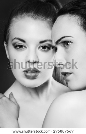 Black and white image portrait of two woman together