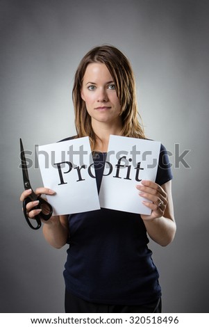 stand woman cutting paper in half with the word share capital written on the paper