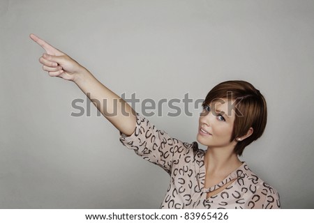 good looking woman pointing her finger at something
