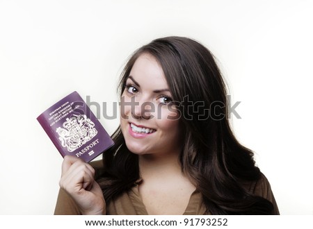 woman holding out a UK passport in her hand