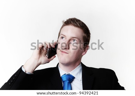 businessman taking a call and he\'s looks like he not sure about something
