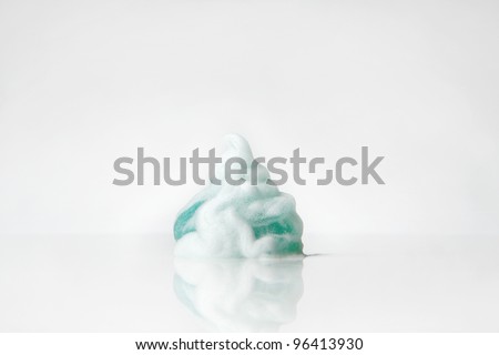 close up detail shot of shaving gel on a white background