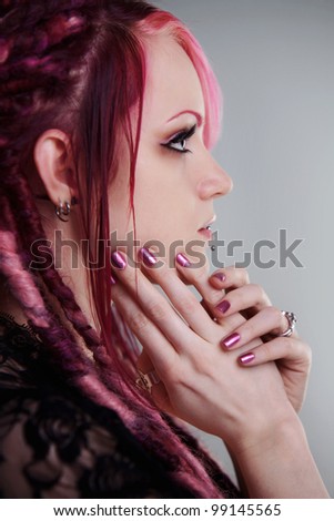 side profile of a woman with dread lock hair