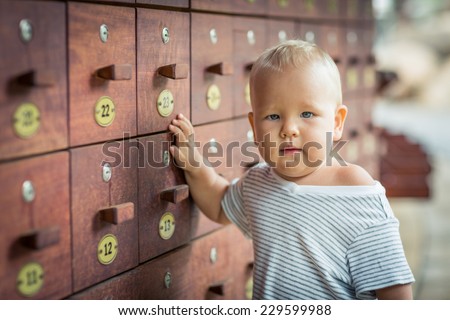 Baby stays near safety boxes