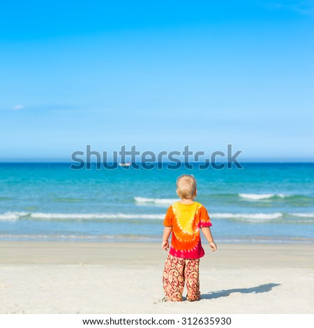 Baby looking sea on the beach