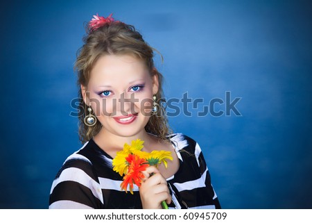 Beautiful woman with flowers in the sea